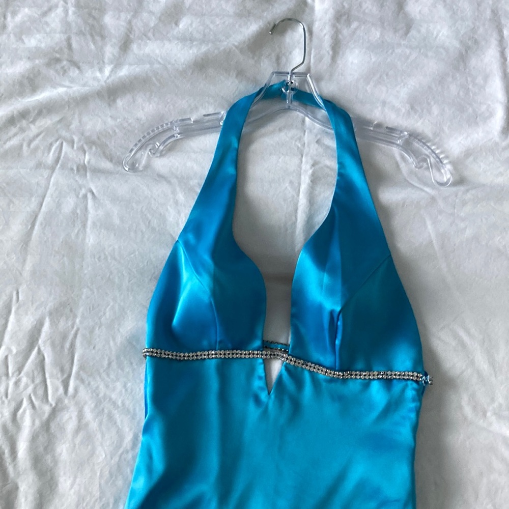 Never worn, halter style, low back, evening dress.  Rhinestone accents.